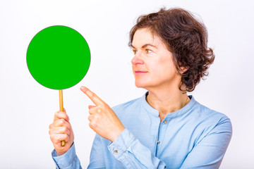Woman holds up signboard