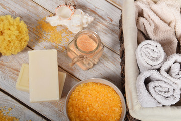 Fototapeta na wymiar bath salt, body scrub, natural soaps and clean towels, bath
