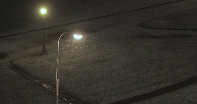 Lantern and sleet at night