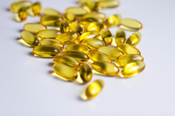  fish oil capsules vitamins on a white background