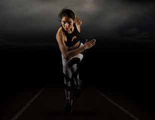 Sporty young woman running