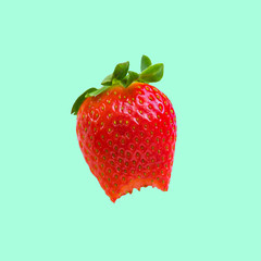 Ripe juicy strawberries. Isolated image on green background.