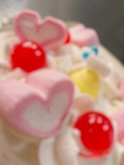 Blurred cream on cake bakery, out of focus heart shape