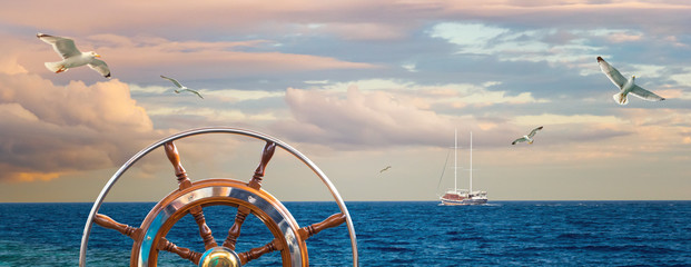 Marine landscape with a captain wheel, seagulls and yacht.