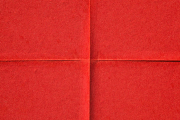 Fototapeta premium Red creased poster texture. Abstract background.