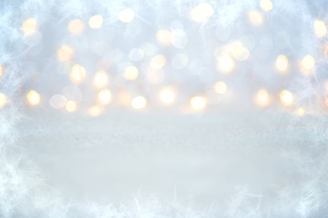 Christmas glowing background. Christmas lights. Holiday New year or Christmas abstract glitter defocused background with blinking stars and sparks. Blurred bokeh.