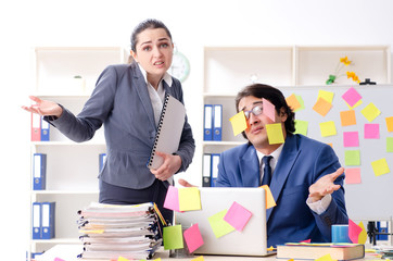 Two colleagues employees working in the office 