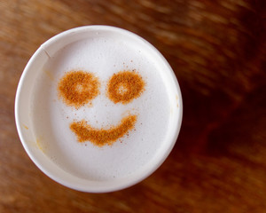 happy face take away coffe on wooden background, space for text