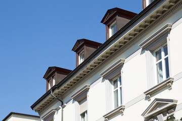 Fototapeta na wymiar Decorated dormer windows in the Baden city of Lörrach in the Black Forest
