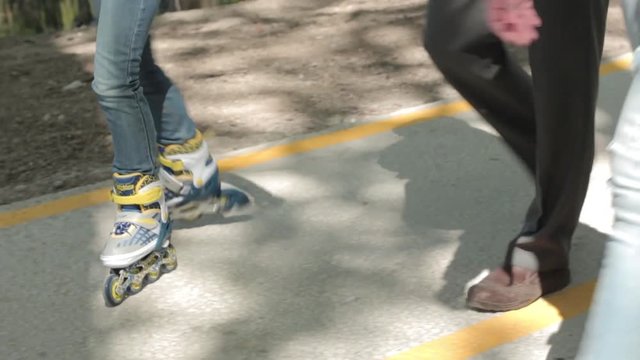 teenage girl skating on roller skates .legs close up