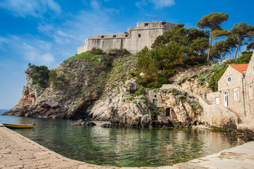Dubrovnik West Pier and the medieval Fort Lovrijenac located on the western wall of the city