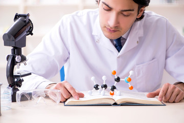 Young male scientist working in the lab 