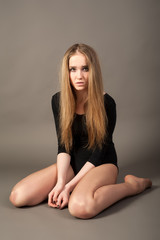 Naklejka premium Attractive sad woman in gymnastic suit