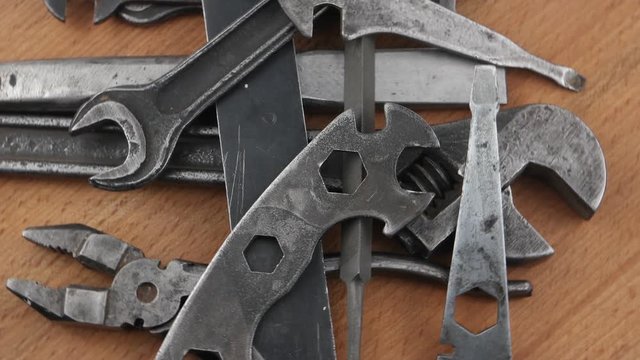Old locksmith tools  laid out on the wooden board, background