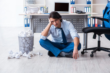 Businessman rejecting new ideas with lots of papers