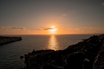 Fototapeta na wymiar Sunset at Fomm Ir-Rih Bay, Malta