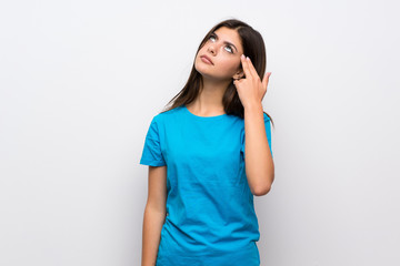 Teenager girl with blue shirt with problems making suicide gesture