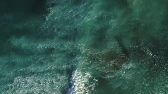 Aerial view of ocaen waves and kitesurfer. Top down view. Aerila video. Cape Town, South Africa. Aerial footage.