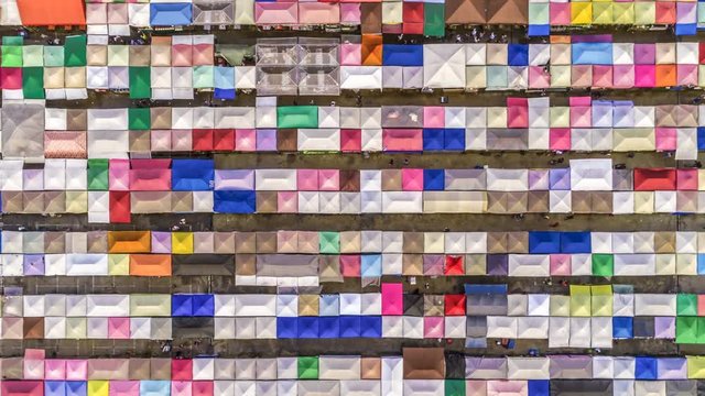 aerial top view train night market ratchada multi color beautiful abstract art time lapse view in bangkok, bangkok market, thailand.
