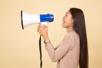 Beautiful young Asian woman announce with megaphone.