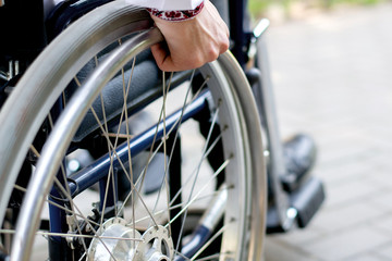 disabled person in a wheelchair on the street a young guy in a wheelchair