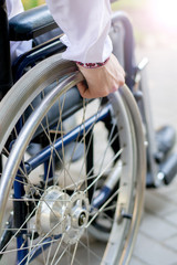 disabled person in a wheelchair on the street a young guy in a wheelchair