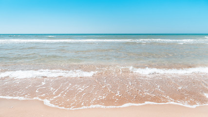 Summer beach background. Sand and sea and sky