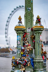 Love locks on Westminster Bridge on electric pole in london