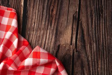 red tablecloth on wooden