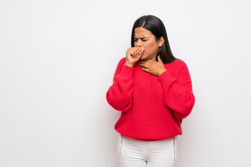 Young Colombian girl with red sweater is suffering with cough and feeling bad