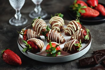 Delicious fresh strawberries in milk and white chocolate.