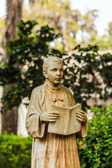 Statue of a choir boy in an old cemetery