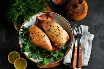 Fresh stuffed squids with rice and mushrooms baked in the oven.