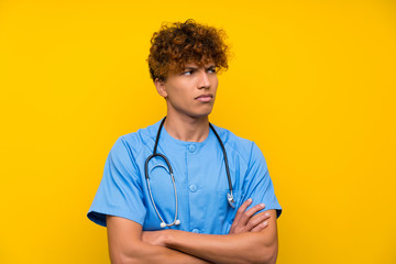 Surgeon doctor african american man standing and thinking an idea