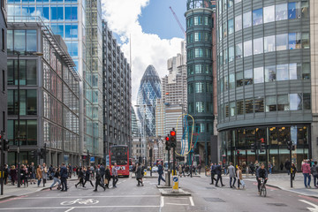 London, UK.  City of London busy street with view  with lots of people crossing the road, cars and...