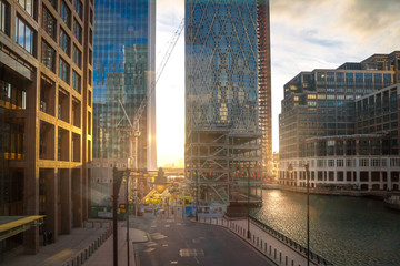 London, UK.  Canary  Wharf  at sunset with beautiful sun reflection