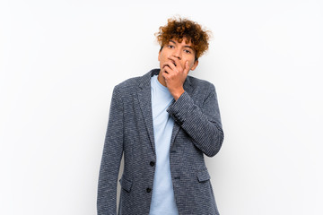 Fashion african american man over isolated white wall surprised and shocked while looking right