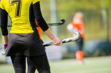 A beautiful young woman field hockey player