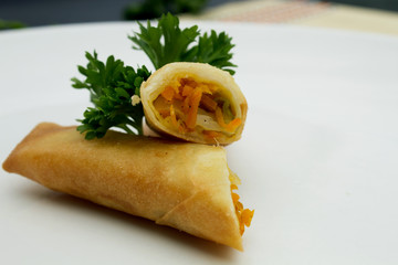Fried Vegetable Spring Rolls in white plate. Harumaki in a plate.