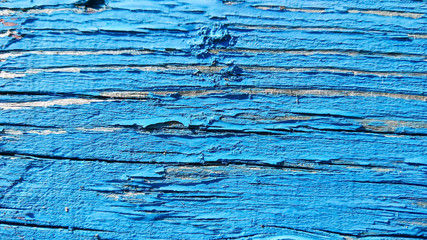 Blue wooden background of cracked surface. Wooden background painted in blue. Abstract rustic pattern