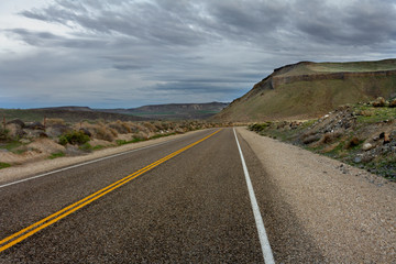 driving on a road with clouds