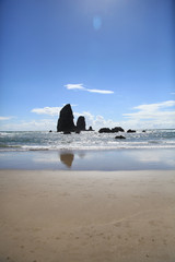 beach with rocks in background 