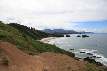 view of the beach from on top of a hill