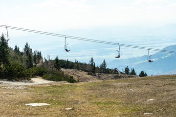 Scenic ski lift chair in nature, lift chair to reach the top of the mountain