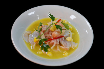 peruvian seafood ceviche in a bowl with black background
