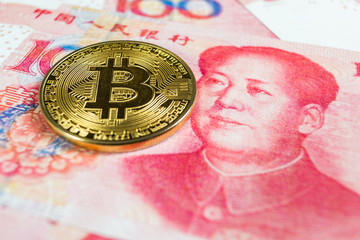 Crypto currency concept - A Bitcoin with Chinese currency RMB, Renminbi, yuan