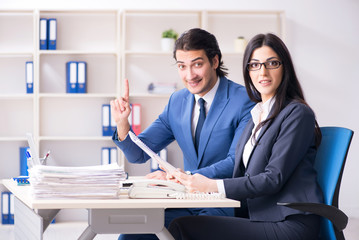Two employees working in the office 