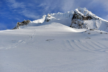 Snow covered terrain on Mount Hood, a volcano in the Cascade Mountains in Oregon popular for...