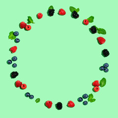 Round frame of berries overhead view flat lay