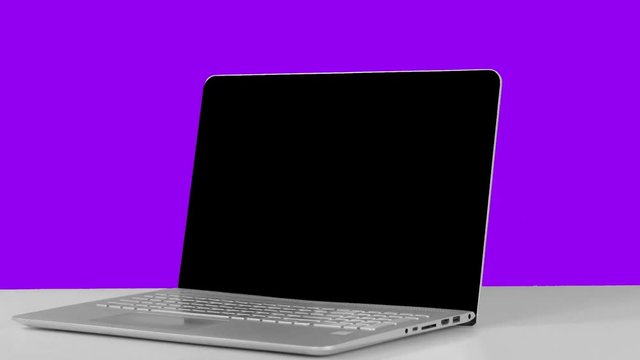 stop motion animation laptop rotated, open and close, purple background
